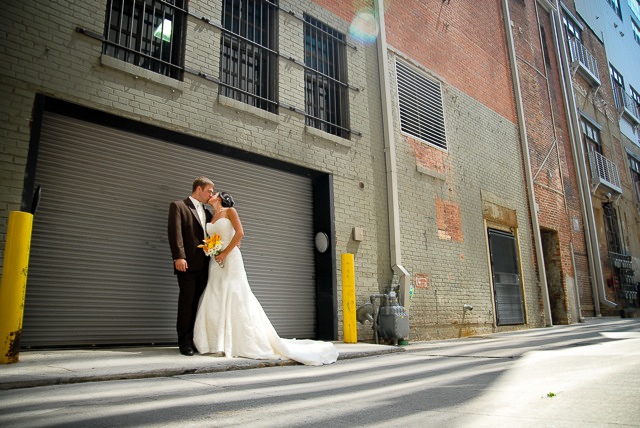 Lotus Blossom Photograph Couple Kissing in Front of Downtown Parking Garage